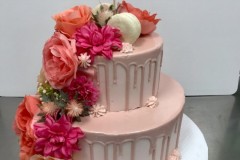 Rose gold tier cake with cascading flowers