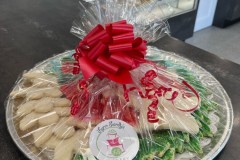 Christmas sugar cookies on wrapped tray