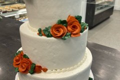 Smooth iced with buttercream flowers